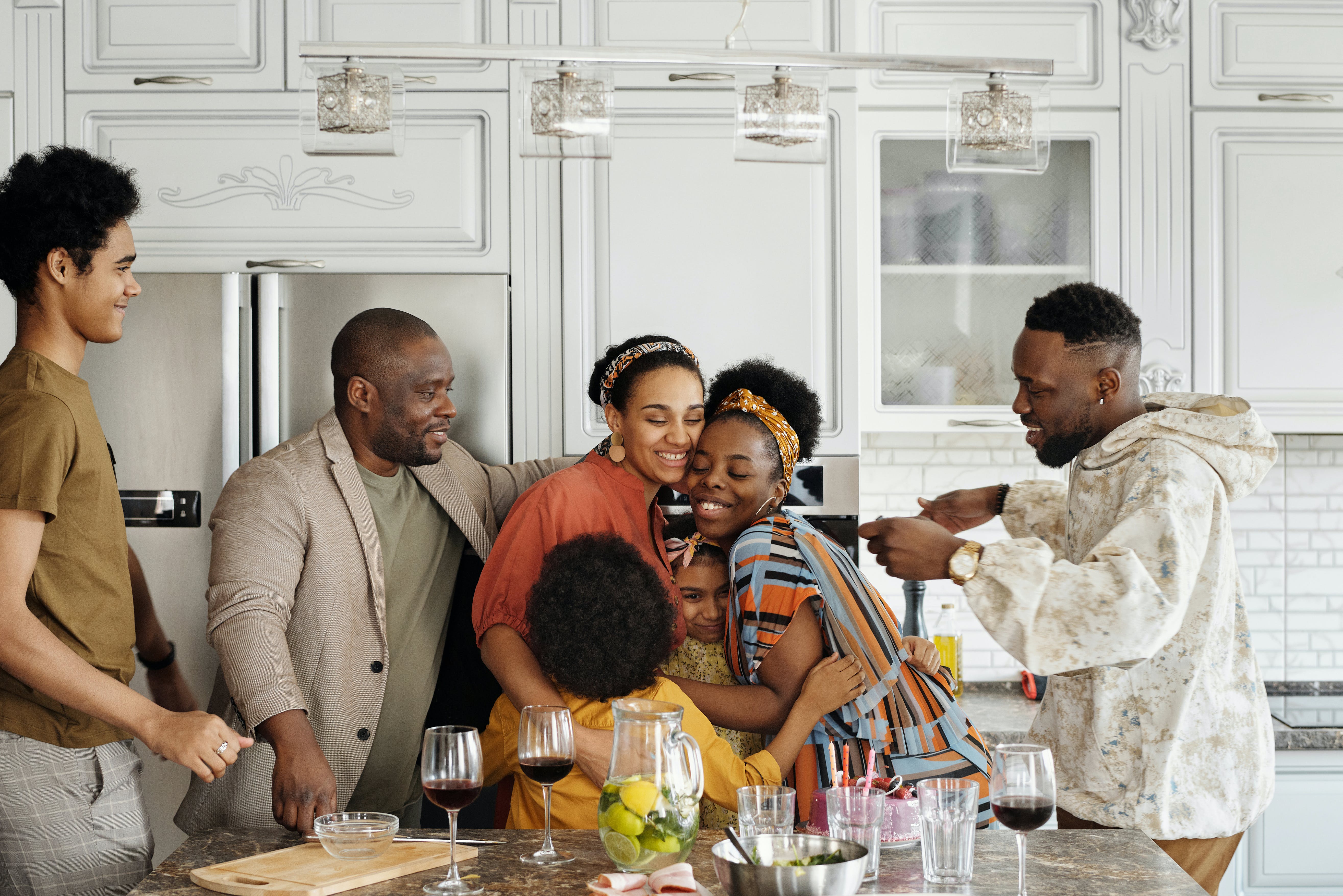 image of a family in the kitchen